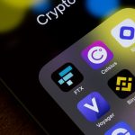 Close-up of a smartphone screen showing cryptocurrency app icons including FTX, Celsius, Binance, Voyager, BlockFi, and Kraken, symbolizing the collapse of major crypto platforms.